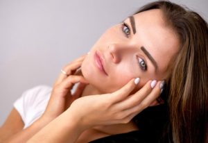 girl touching face